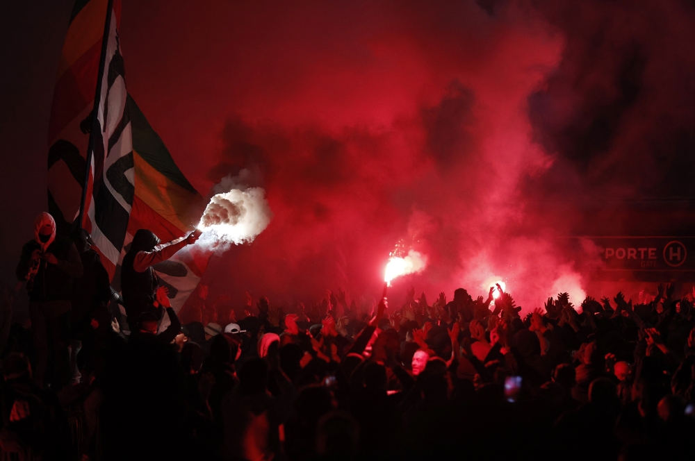 Paris St Germain fans with flares outside the stadium during the match REUTERS/Benoit Tessier