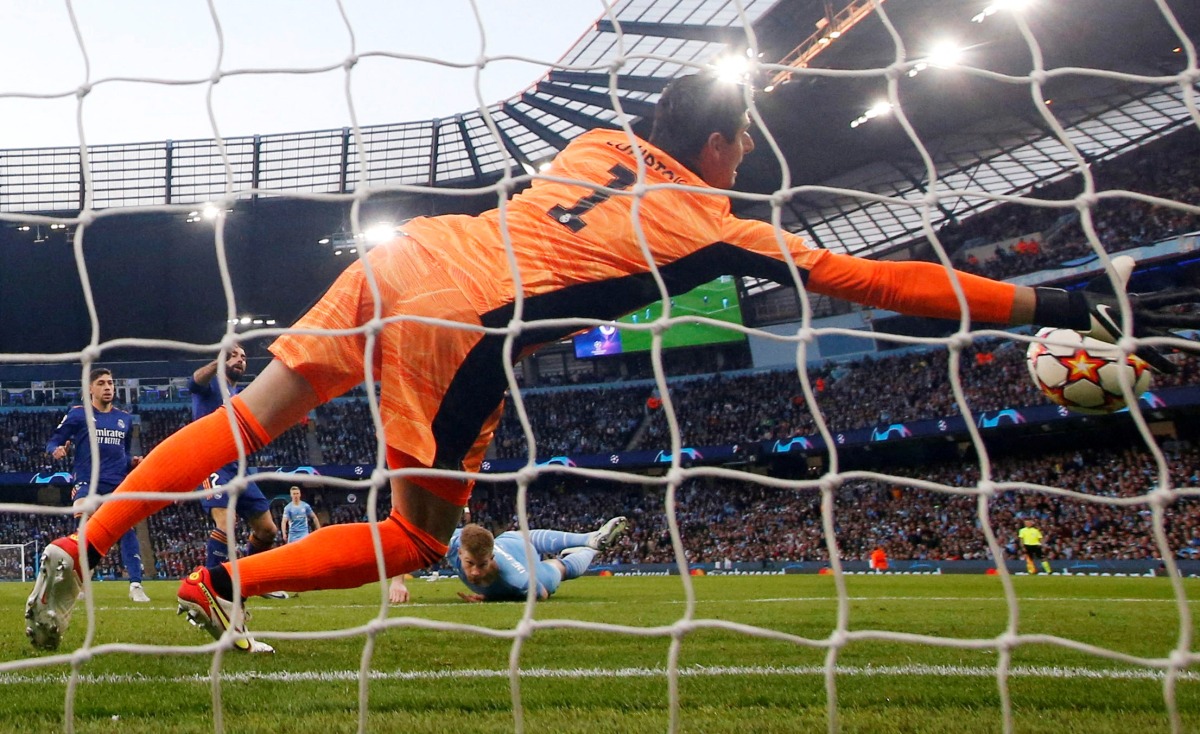 Manchester City's Kevin De Bruyne scores their first goal past Real Madrid's Thibaut Courtois REUTERS/Craig Brough TPX IMAGES OF THE DAY
