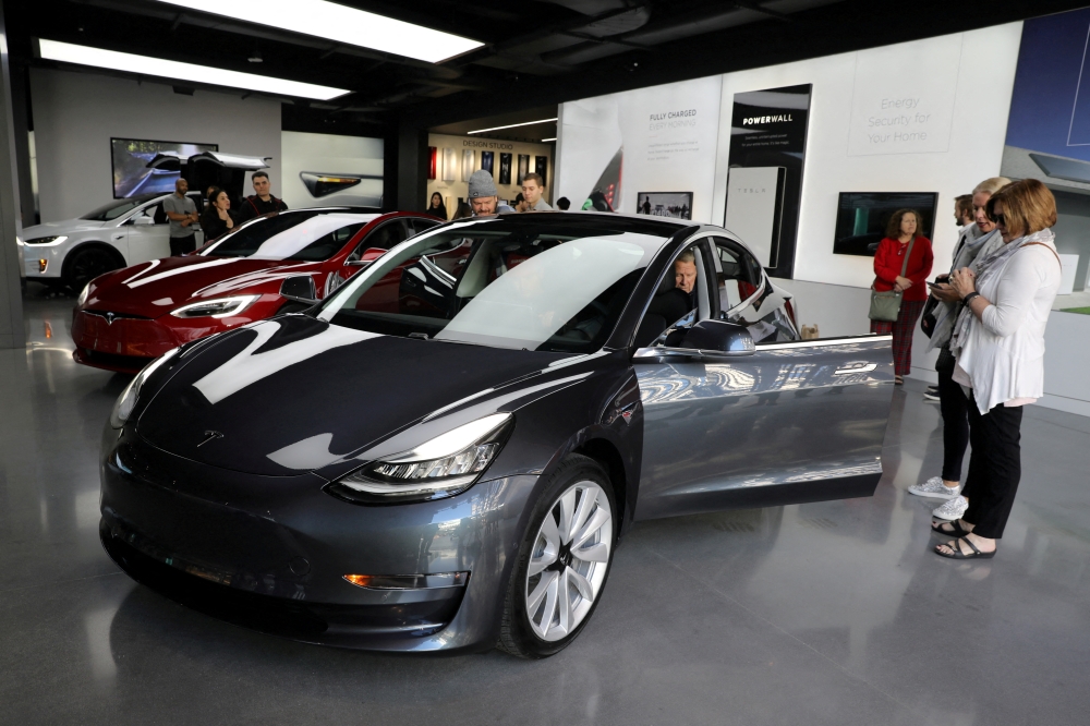 A Tesla Model 3 is seen in a showroom in Los Angeles, California U.S. January 12, 2018. REUTERS/Lucy Nicholson//File Photo