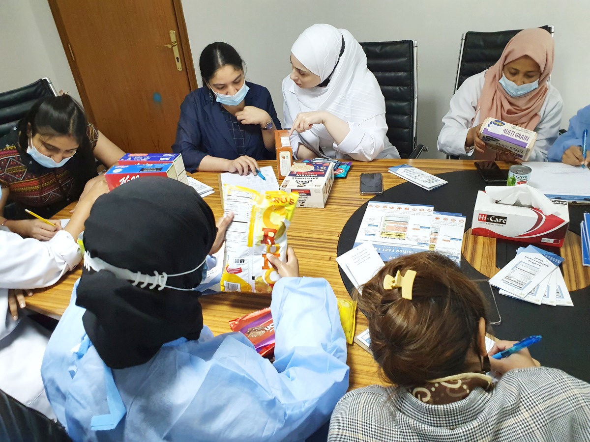 Students learn how to read nutrition labels during the workshop. 