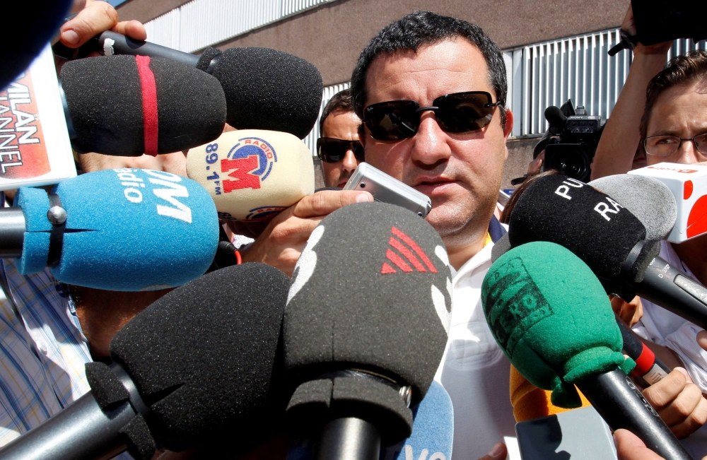 FILE PHOTO: Soccer agent Mino Raiola speaks to the media as he arrives at FC Barcelona's office in Barcelona, Spain August 26, 2010. REUTERS/Albert Gea