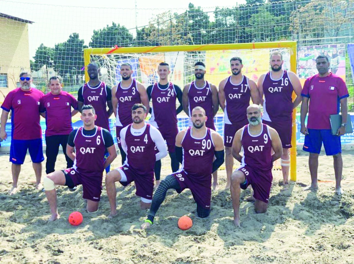 Qatar beach handball players and officials.