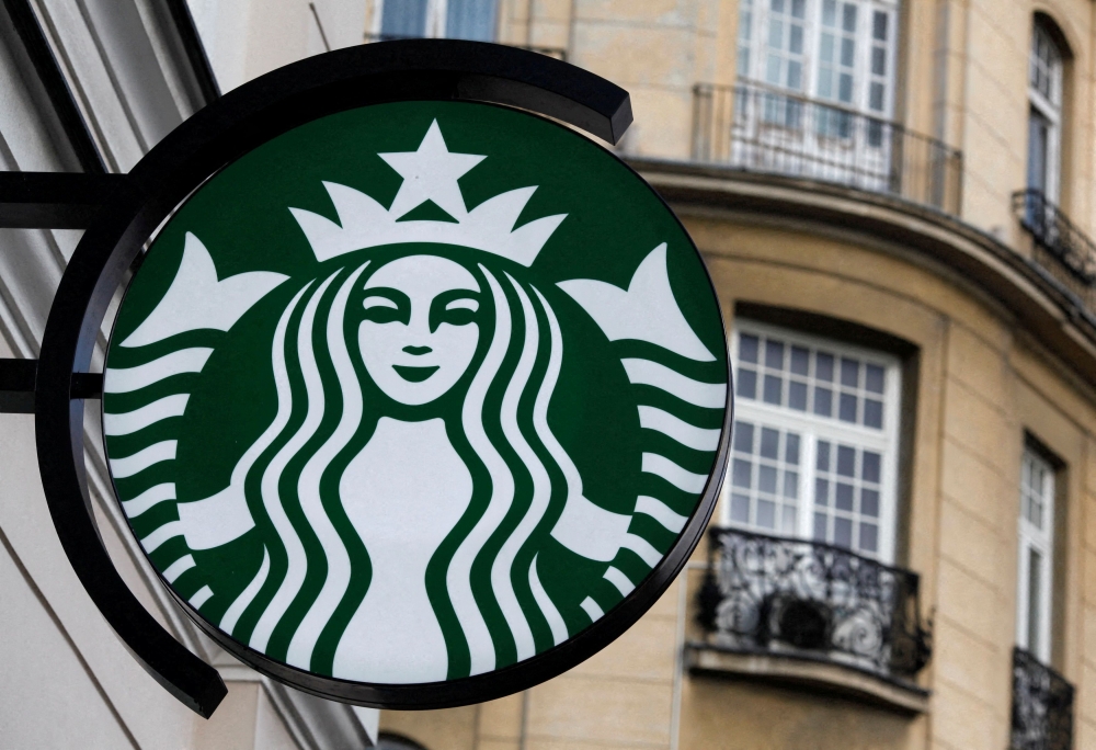 The Starbucks logo is seen outside a Starbucks cafe in Warsaw March 6, 2011. REUTERS/Kacper Pempel/File Photo