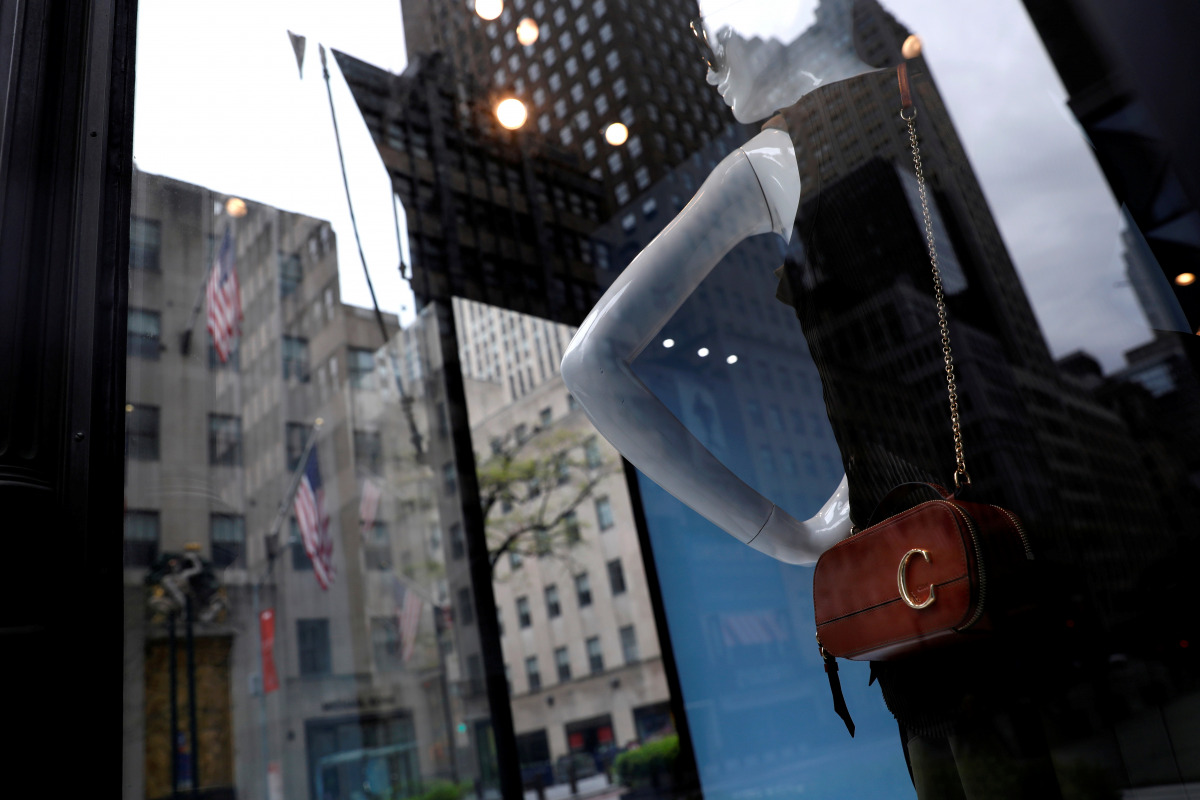 FILE PHOTO: Mannequins are seen inside a closed Gucci store on 5th Avenue, during the outbreak of the coronavirus disease (COVID-19), in Manhattan, New York city, New York, U.S., May 11, 2020. REUTERS/Mike Segar/File Photo

