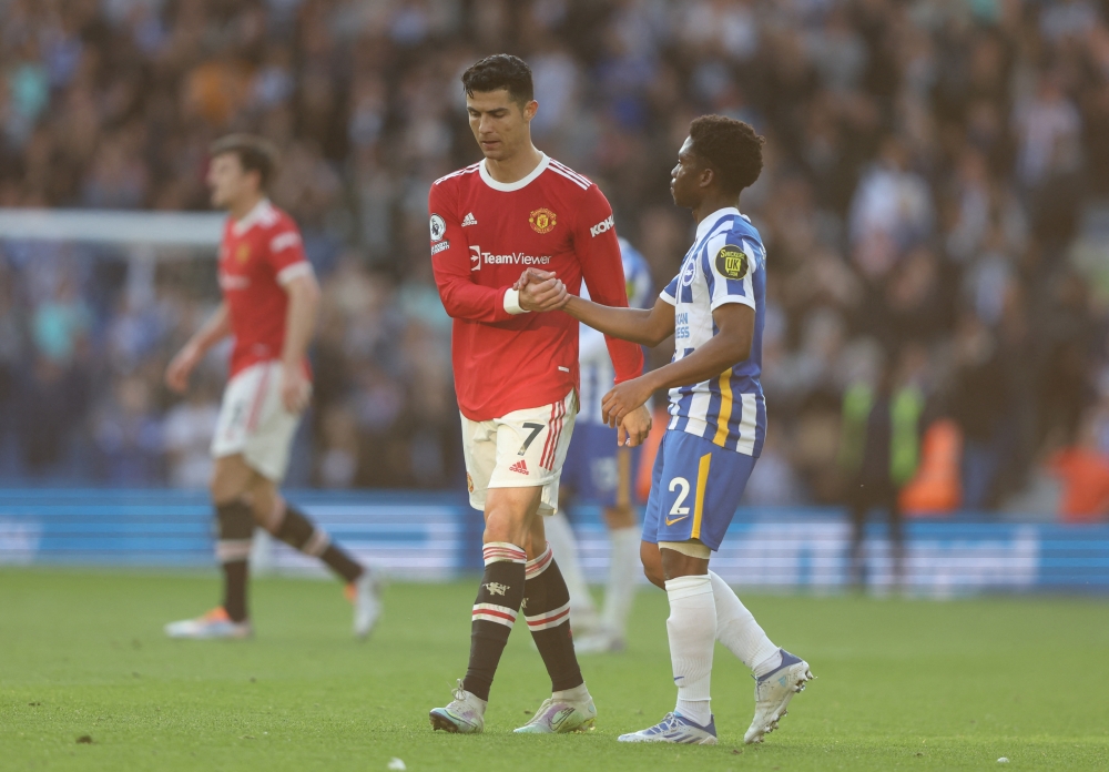 Manchester United's Cristiano Ronaldo shakes hands with Brighton & Hove Albion's Tariq Lamptey after the match REUTERS/Ian Walton 
