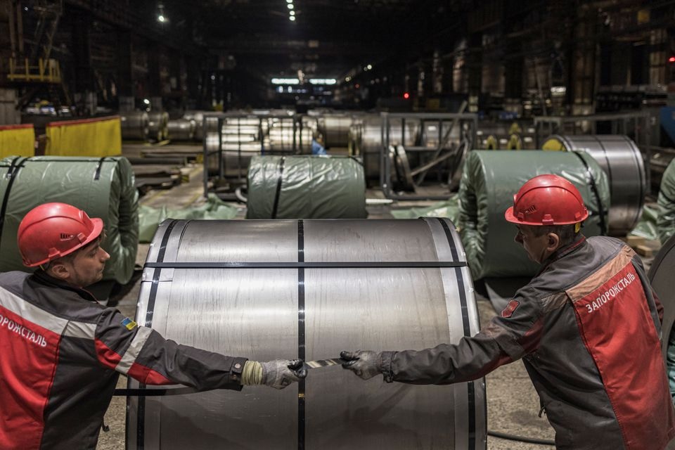 Workers roll steel products at Zaporizhstal, Ukraine's third-biggest metals plant, as Russia's invasion of Ukraine continues, in Zaporizhzhia, Ukraine, March 30, 2022. REUTERS/Marko Djurica


