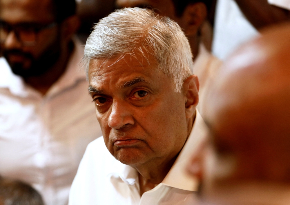 File photo: Ranil Wickremesinghe, newly appointed prime minister, arrives at a Buddhist temple after his swearing-in ceremony amid the country's economic crisis, in Colombo, Sri Lanka, May 12, 2022. Reuters/Dinuka Liyanawatte/File Photo
 
