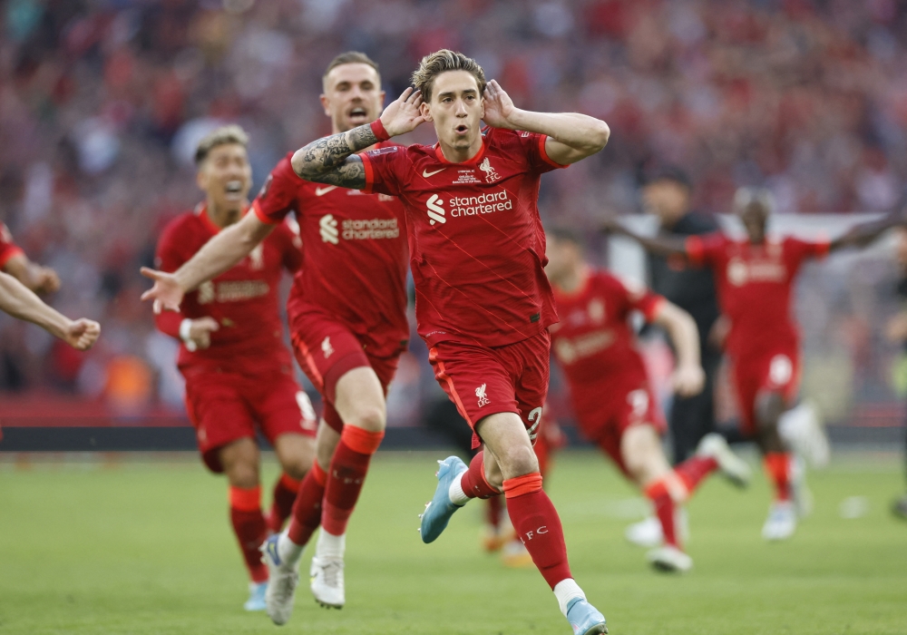 Soccer Football - FA Cup - Final - Chelsea v Liverpool - Wembley Stadium, London, Britain - May 14, 2022 Liverpool's Kostas Tsimikas celebrates after scoring the winning penalty in the shoot-out Action Images via Reuters.