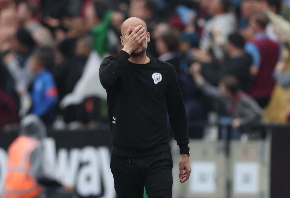 Manchester City manager Pep Guardiola reacts after Manchester City's Riyad Mahrez has a penalty saved by West Ham United's Lukasz Fabianski Action Images via Reuters/Matthew Childs 