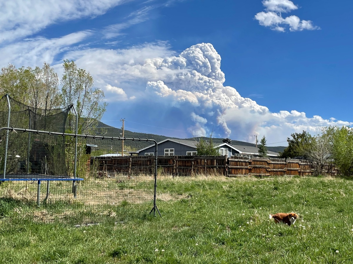 Smoke rising from the Calf Creek Hermits Peak fire burning forests and watershed below Jicarita Peak in the Pecos Wilderness is seen from Taos, New Mexico, U.S., May 15, 2022. Picture taken May 15, 2022. REUTERS/Andrew Hay

