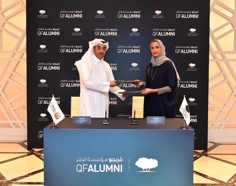 The Minister of Labour H E  Dr. Ali bin Smaikh Al Marri and Vice-Chairperson and CEO of Qatar Foundation H E Sheikha Hind bint Hamad Al Thani exchanging the signed documents.