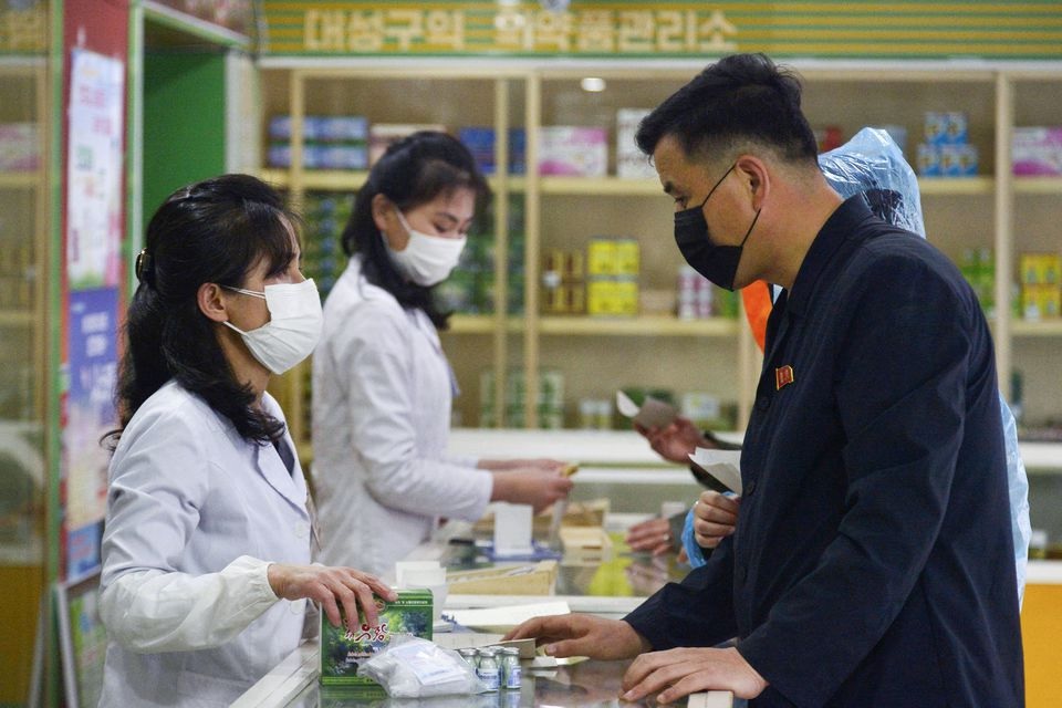 A man visits a pharmacy, amid growing fears over the spread of the coronavirus disease (COVID-19), in Pyongyang, North Korea, in this photo taken on May 16, 2022 and released by Kyodo on May 17, 2022. Kyodo/via REUTERS/File Photo

