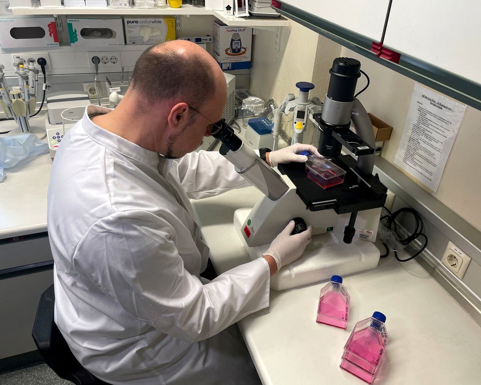 Head of the Institute of Microbiology of the German Armed Forces Roman Woelfel works in his laboraty in Munich, May 20, 2022, after Germany has detected its first case of monkeypox. REUTERS/Christine Uyanik