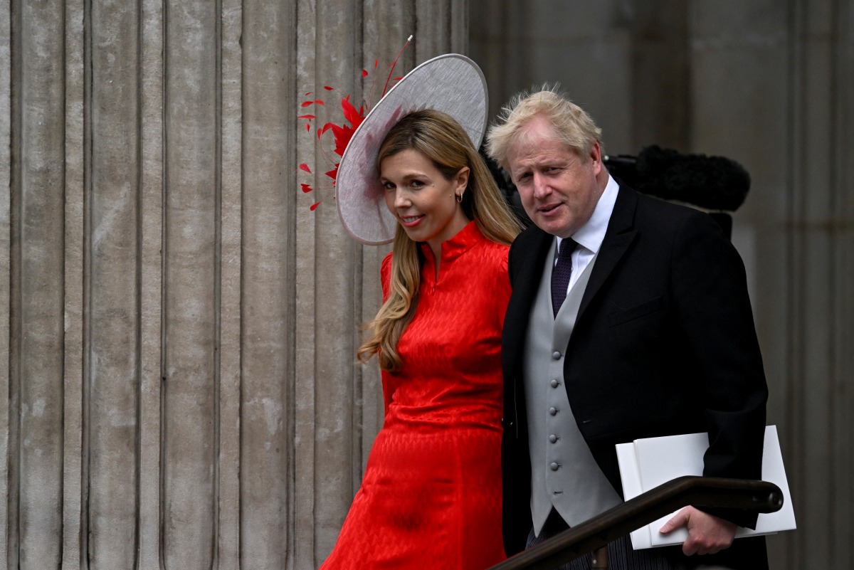 British Prime Minister Boris Johnson and his wife Carrie Johnson leave after the National Service of Thanksgiving held at St Paul's Cathedral as part of celebrations marking the Platinum Jubilee of Britain's Queen Elizabeth, in London, Britain, June 3, 2022. REUTERS/Dylan Martinez
