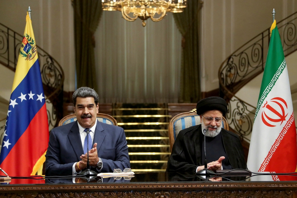 Iranian President Ebrahim Raisi and Venezuelan President Nicolas Maduro attend a news conference in Tehran, Iran, June 11, 2022.