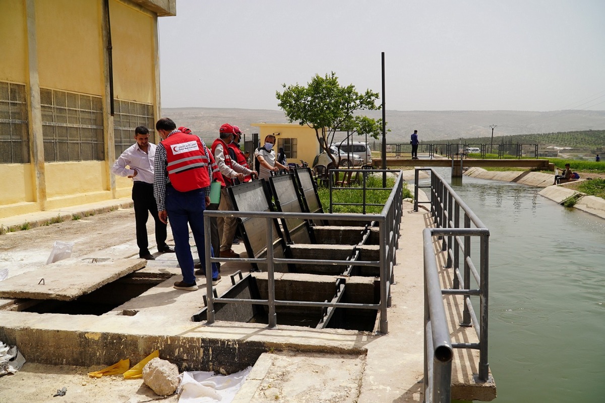 Qatar Red Crescent Society (QRCS)  officials at the work site.