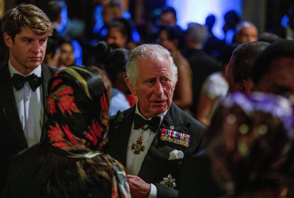 Britain's Prince Charles talks to guests at the Commonwealth Heads of Government Dinner, hosted by him and Camilla, the Duchess of Cornwall, on the sidelines of the Commonwealth Heads of Government Meeting (CHOGM) in Kigali, Rwanda June 24, 2022. (REUTERS/Jean Bizimana)