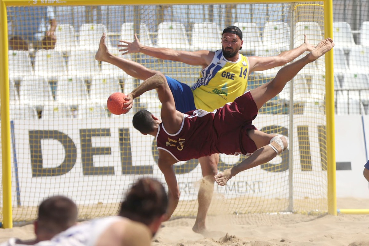 Qatar's Ahmad Murad Abdulrazzaq prepares to shoot during the match against Greece.
