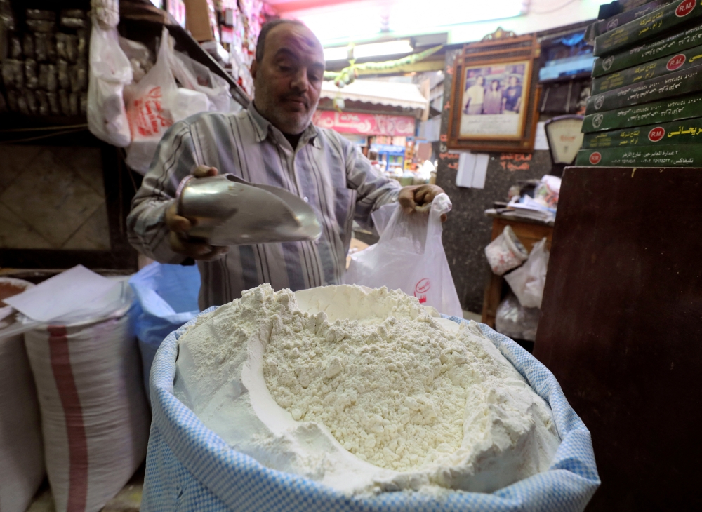 A worker at a herbal store buys flour in Cairo, Egypt. (Reuters/Mohamed Abd El Ghany/File Photo)