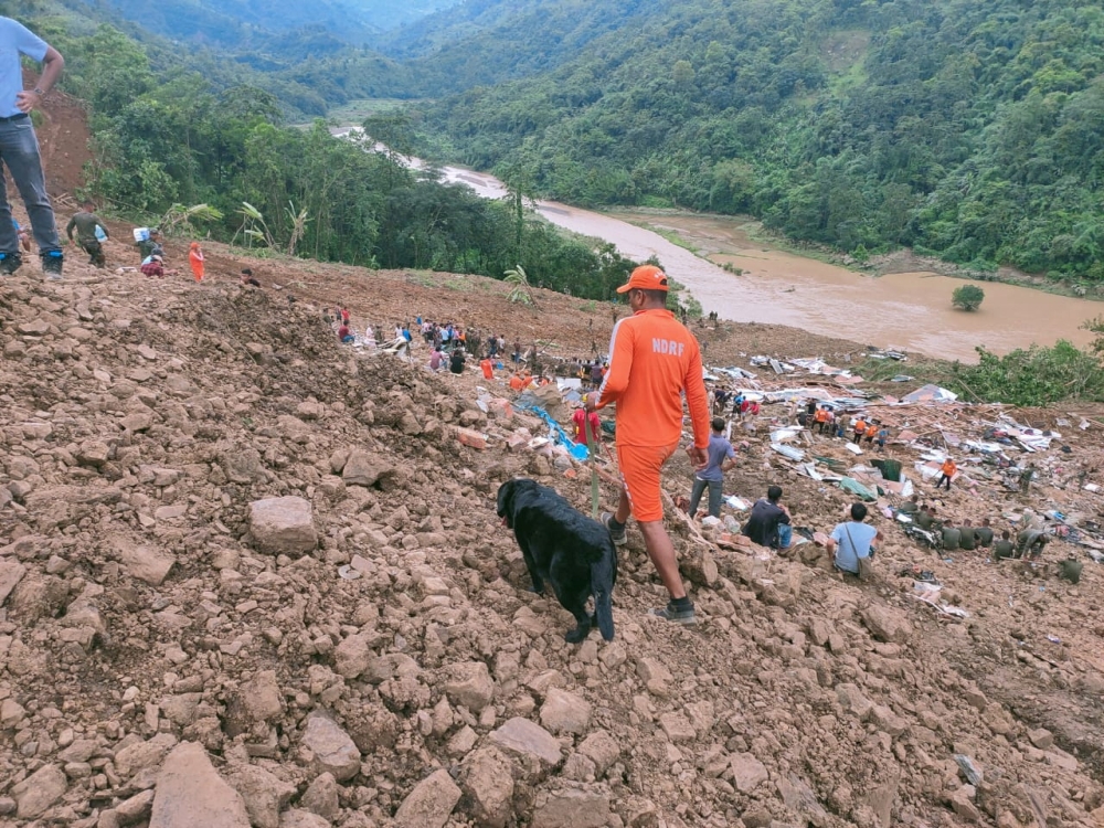 Members of rescue teams search for survivors after a landslide in Noney in the northeastern state of Manipur, India, June 30, 2022. National Disaster Response Force/Handout via REUTERS