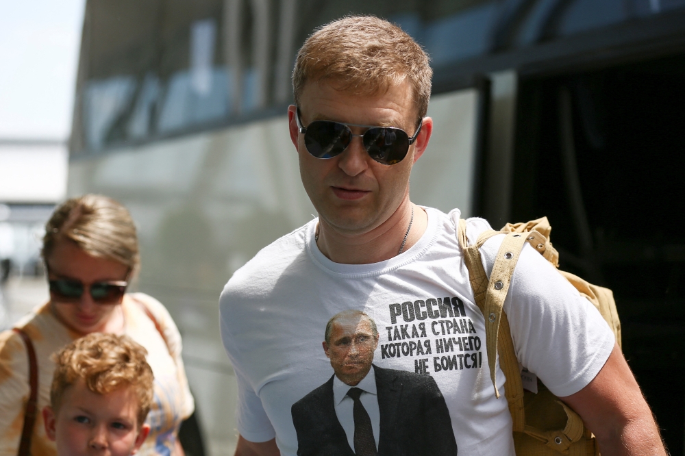 Russian embassy employees and family members depart, after the Bulgarian government's decision to expel 70 Russian diplomatic staff, at Sofia airport, Bulgaria, July 3, 2022. (Reuters/Spasiyana Sergieva)