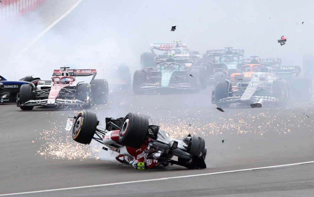 Alfa Romeo's Guanyu Zhou crashes out at the start of the race. (Reuters/Molly Darlington)