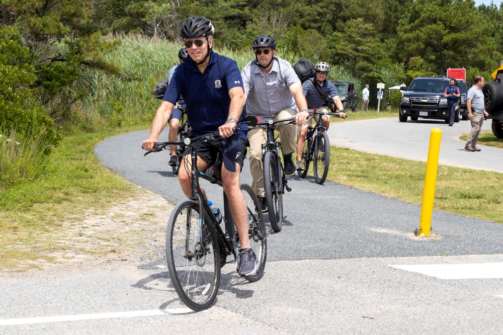 US President Joe Biden takes a bike ride at Gordons Pond in Rehoboth Delaware, US, July 10, 2022. (REUTERS/Tasos Katopodis)