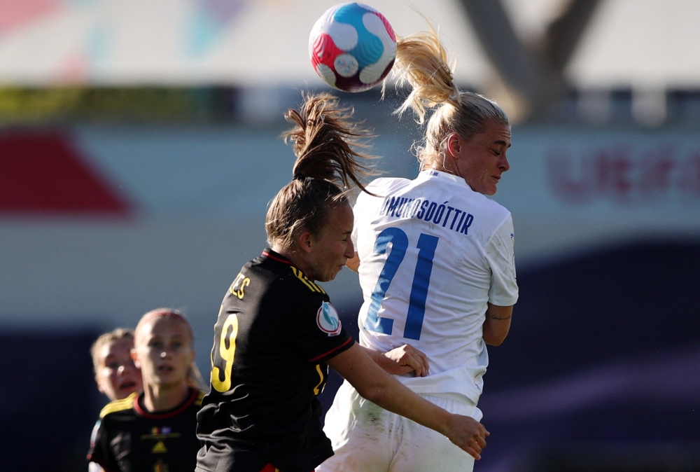  Iceland's Svava Ros Gudmundsdottir in action with Belgium's Sari Kees. (REUTERS/Molly Darlington)