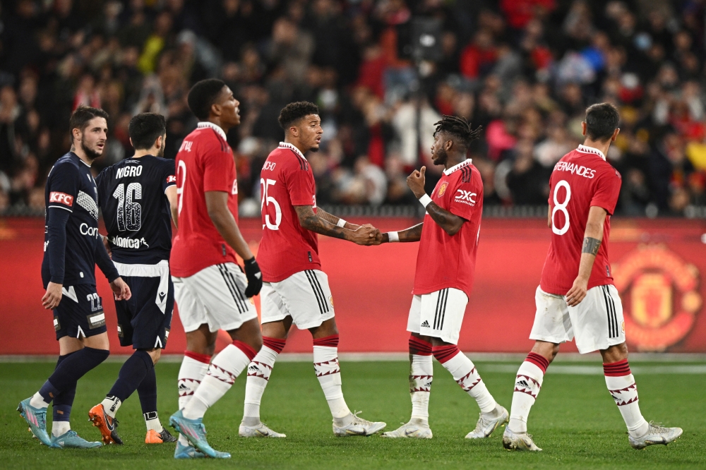 Manchester United players celebrate their first goal scored by Scott McTominay. (Joel Carrett/AAP/REUTERS)