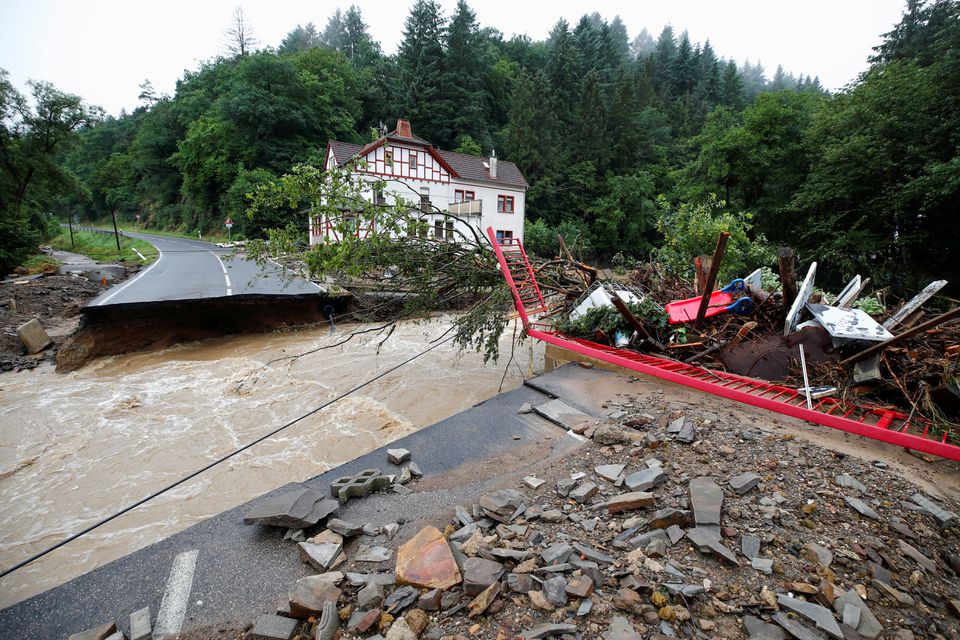 A destroyed road next to the Ahr river is seen on a flood-affected area following heavy rainfalls in Schuld, Germany, on July 15, 2021. REUTERS/Wolfgang Rattay/File Photo


