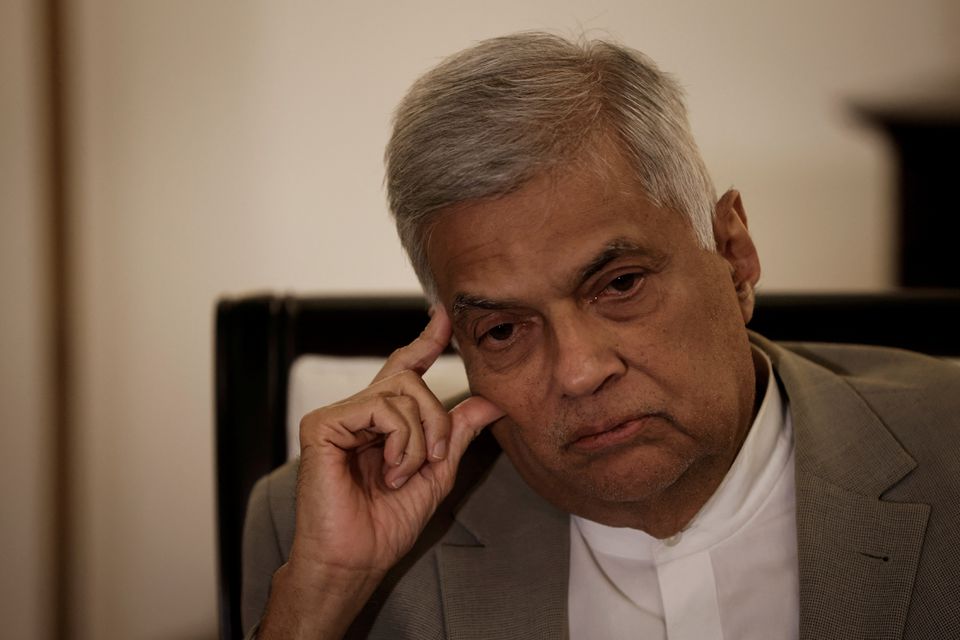 Sri Lanka's Prime Minister Ranil Wickremesinghe gestures as he speaks during an interview with Reuters at his office in Colombo, Sri Lanka, May 24, 2022. REUTERS/Adnan Abidi/File Photo