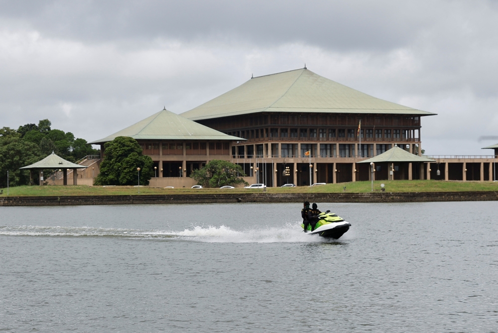 Security personnel patrol on a jet ski in the premises of the Parliament building, as voting begins to elect the new President, amid the country's economic crisis, in Colombo, Sri Lanka July 20, 2022. REUTERS/Adnan Abidi