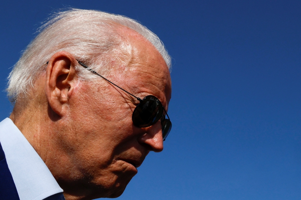 U.S. President Joe Biden speaks to the media as he arrives at Joint Base Andrews, Maryland, U.S. July 20, 2022. REUTERS/Jonathan Ernst