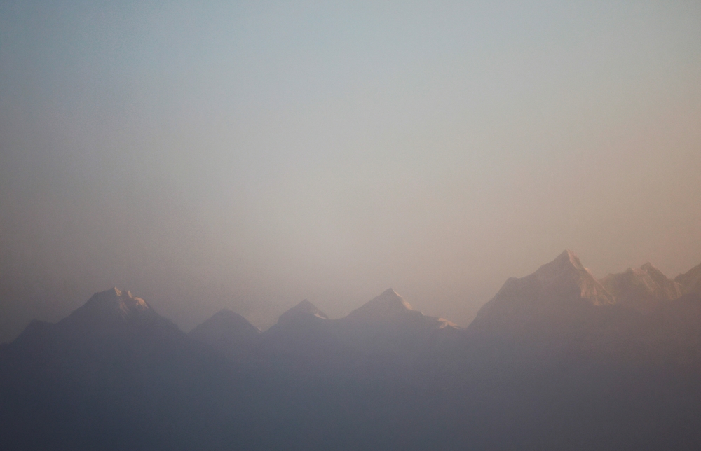 Mount Everest, the world highest peak, and other peaks of the Himalayan range are seen during the sunrise from Ratnange hill in Solukhumbu, Nepal March 27, 2022. REUTERS/Navesh Chitrakar/File Photo