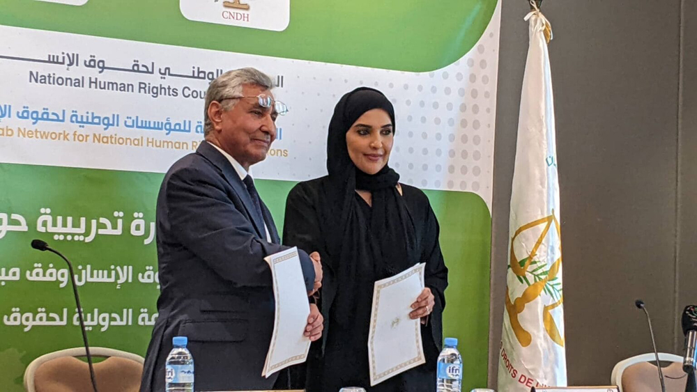 Chairperson of the NHRC H E Maryam bint Abdullah Al Attiyah and Chairman of the Algerian CNDH H E Abdel Majid Zaalani during the signing of the  memorandum.
