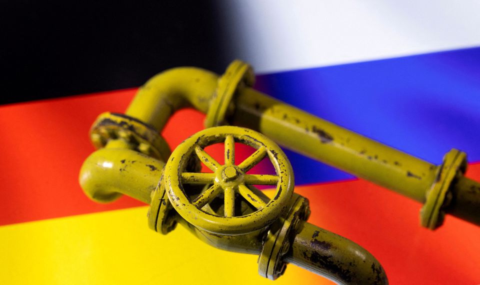 3D printed Natural Gas Pipes are placed on displayed German and Russian flags in this illustration taken, January 31, 2022. REUTERS/Dado Ruvic/Illustration

