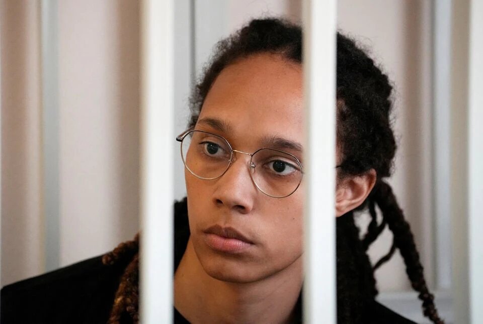 WNBA star and two-time Olympic gold medalist Brittney Griner sits in a cage at a court room prior to a hearing, in Khimki , outside Moscow, Russia, July 27, 2022. Alexander Zemlianichenko/Pool via REUTERS