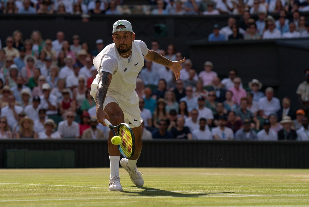 Jul 10, 2022; London, United Kingdom; Nick Kyrgios (AUS) returns a shot during the men’s final against Novak Djokovic (not pictured) on day 14 at All England Lawn Tennis and Croquet Club. Mandatory Credit: Susan Mullane-USA TODAY Sports/File Photo