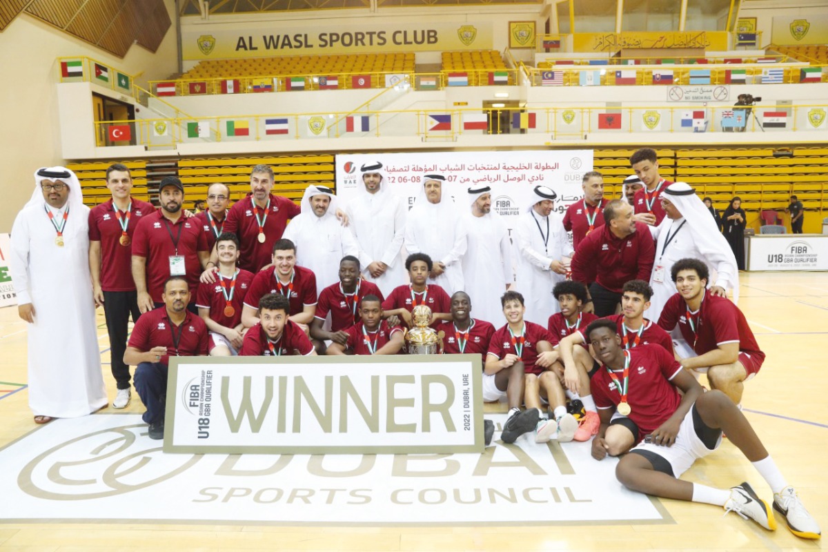 Qatar players and officials celebrate with the trophy 