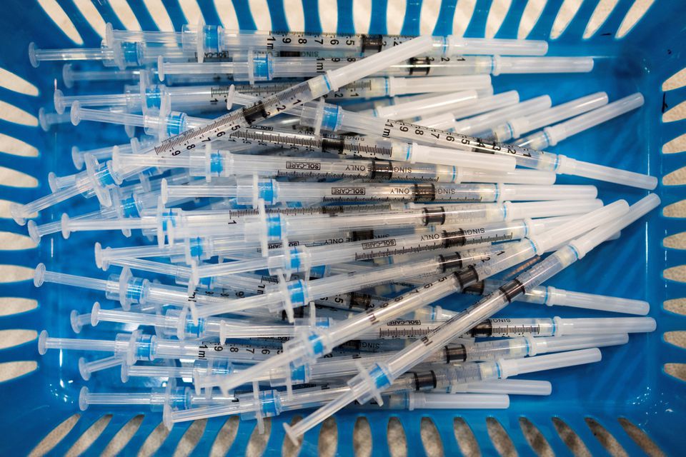 Doses of the Pfizer-BioNTech vaccine against the coronavirus disease (COVID-19) are pictured at a booster clinic for 12 to 17-year-olds in Lansdale, Pennsylvania, U.S., January 9, 2022. REUTERS/Hannah Beier/File Photo

