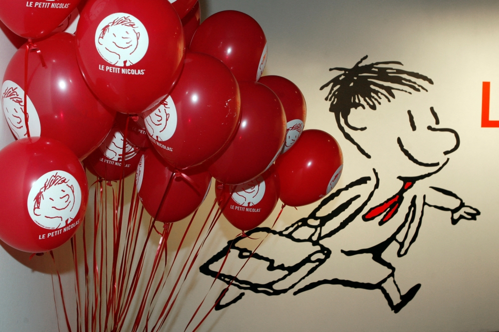 Balloons and a poster of Le Petit Nicolas (Little Nicolas) are seen during the exhibition dedicated to him at Paris City Hall March 5, 2009. Created 50 years ago by writer Rene Goscinny, also the author of Asterix, and Jean-Jacques Sempe, an illustrator who has drawn covers for the New Yorker magazine, Le Petit Nicolas (Little Nicolas) is one of France's best loved characters. REUTERS/Charles Platiau/File Photo