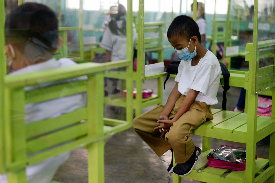 File Photo: Students attend a class in an elementary school in Pasay City, Metro Manila, Philippines, on December 6, 2021. (REUTERS/Lisa Marie David)