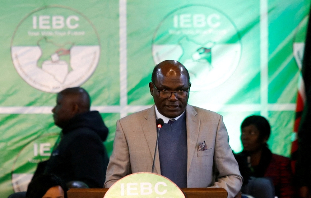 Independent Electoral and Boundaries Commission (IEBC) chairman Wafula Chebukati addresses delegates on the general election, the IEBC National Tallying centre at the Bomas of Kenya, in Nairobi, Kenya August 11, 2022. REUTERS/Monicah Mwangi REFILE - CORRECTING INFORMATION
