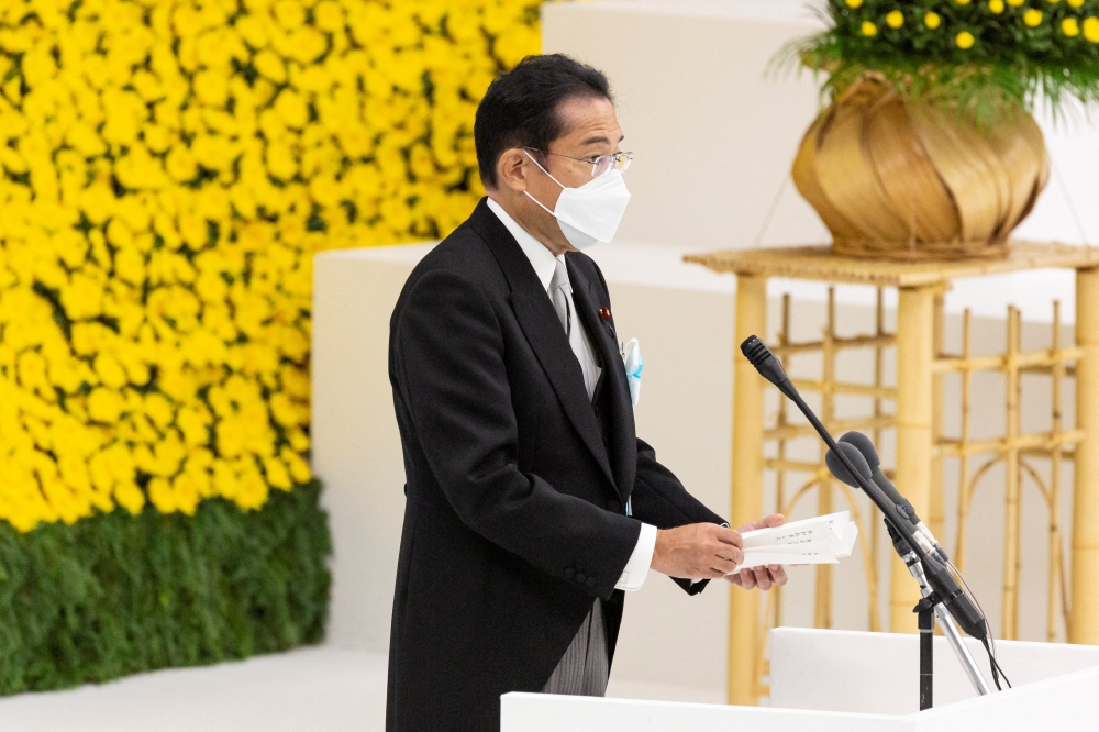 Japan's Prime Minister Fumio Kishida speaks during a memorial service marking the 77th anniversary of Japan's surrender in World War II at the Nippon Budokan hall in Tokyo, Japan, August 15, 2022. (Yuichi Yamazaki/Pool via REUTERS)