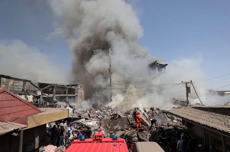 Smoke rises after blasts ripped through a fireworks warehouse in a shopping mall in Yerevan, Armenia August 14, 2022. Hayk Baghdasaryan/Photolure via REUTERS

