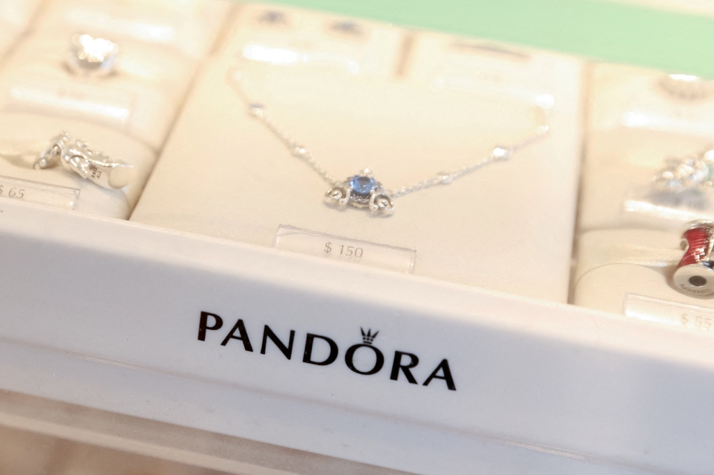 Pandora products are seen at their store at the Woodbury Common Premium Outlets in Central Valley, New York, U.S., February 15, 2022. REUTERS/Andrew Kelly/File Photo