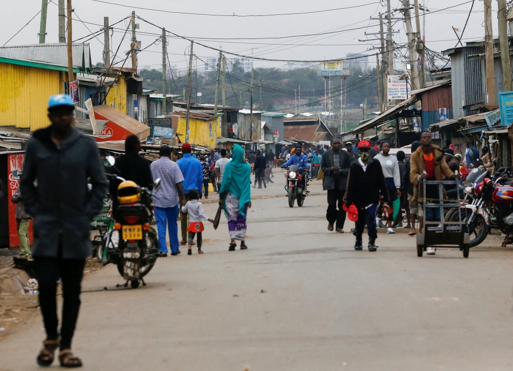 A general view shows people walking along the main street following announcement of the results of Kenya's presidential election, in Silanga village, Kibera slums of Nairobi, Kenya August 16, 2022. Reuters/Thomas Mukoya