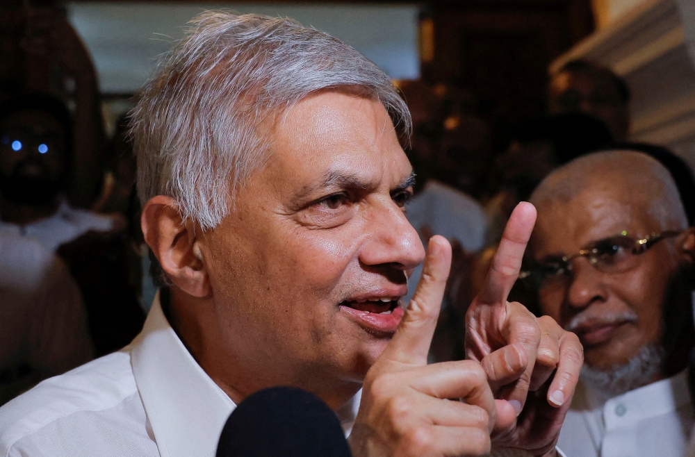 File Photo: President Ranil Wickremesinghe speaks to media as he leaves a Buddhist temple, amid the country's economic crisis, in Colombo, Sri lanka, July 20, 2022. (REUTERS/ Dinuka Liyanawatte)