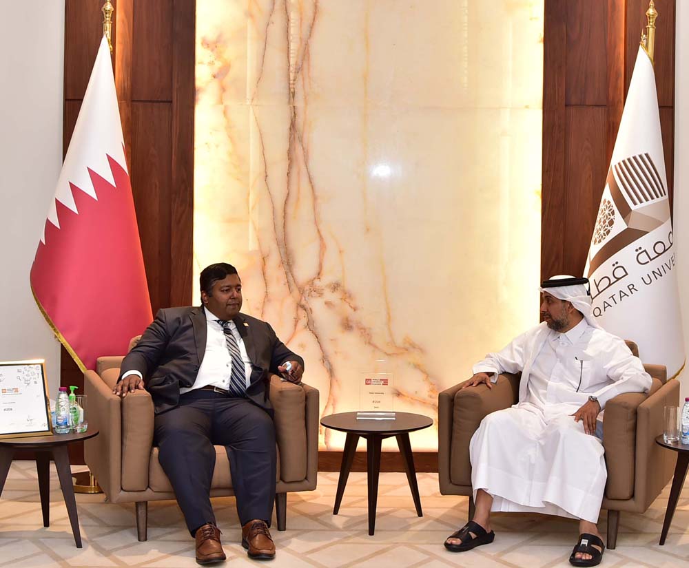 Dr. Hassan Al Derham, President of Qatar University, receiving Dr. Ashwin Fernandez, QS Regional Director of the Middle East, North Africa and South Asia.