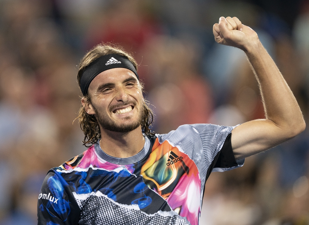 Stefanos Tsitsipas (GRE) celebrates after defeating Daniil Medvedev (RUS) at the Western & Southern Open at the Lindner Family Tennis Center. Susan Mullane-USA TODAY Sports